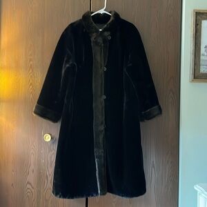 Brand Removed beautiful black faux fur coat with dark brown trim. Size Large